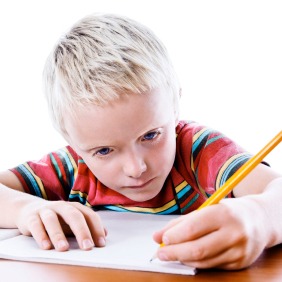 Elementary aged child writing