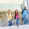 Elementary school pupils running outside