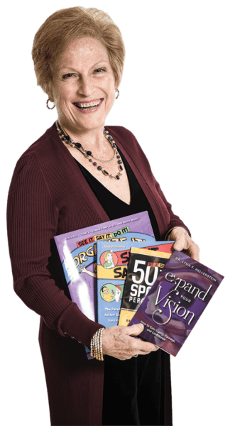 Dr. Lynn Hellerstein holding four of her published books